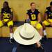 A photographer takes a photo of Michigan football players in the locker room during media day on Sunday, August 11, 2013. Melanie Maxwell | AnnArbor.com